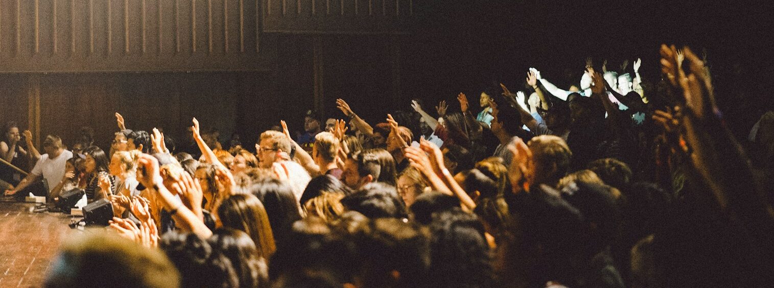people raising their hands