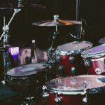 selective focus photography of red drum set